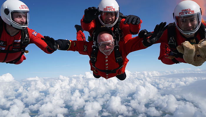 A Chelsea Pensioner sky dives with the Red Devils