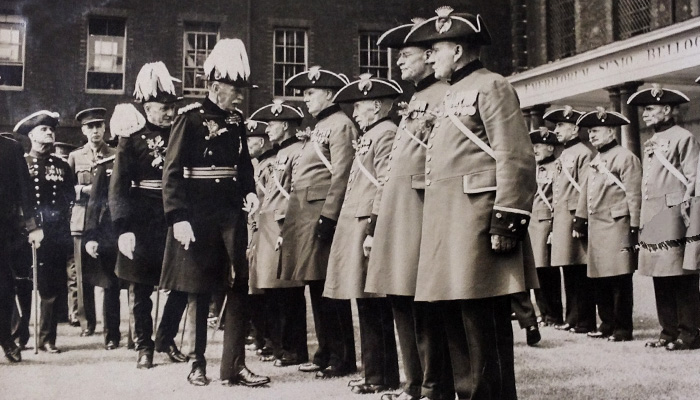 Historic black & white photo of the Chelsea Pensioners on parade at Founder's Day