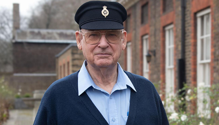 Chelsea Pensioner, Roger Hall, standing in the grounds of the Royal Hospital Chelsea in his traditional "Blues" uniform.