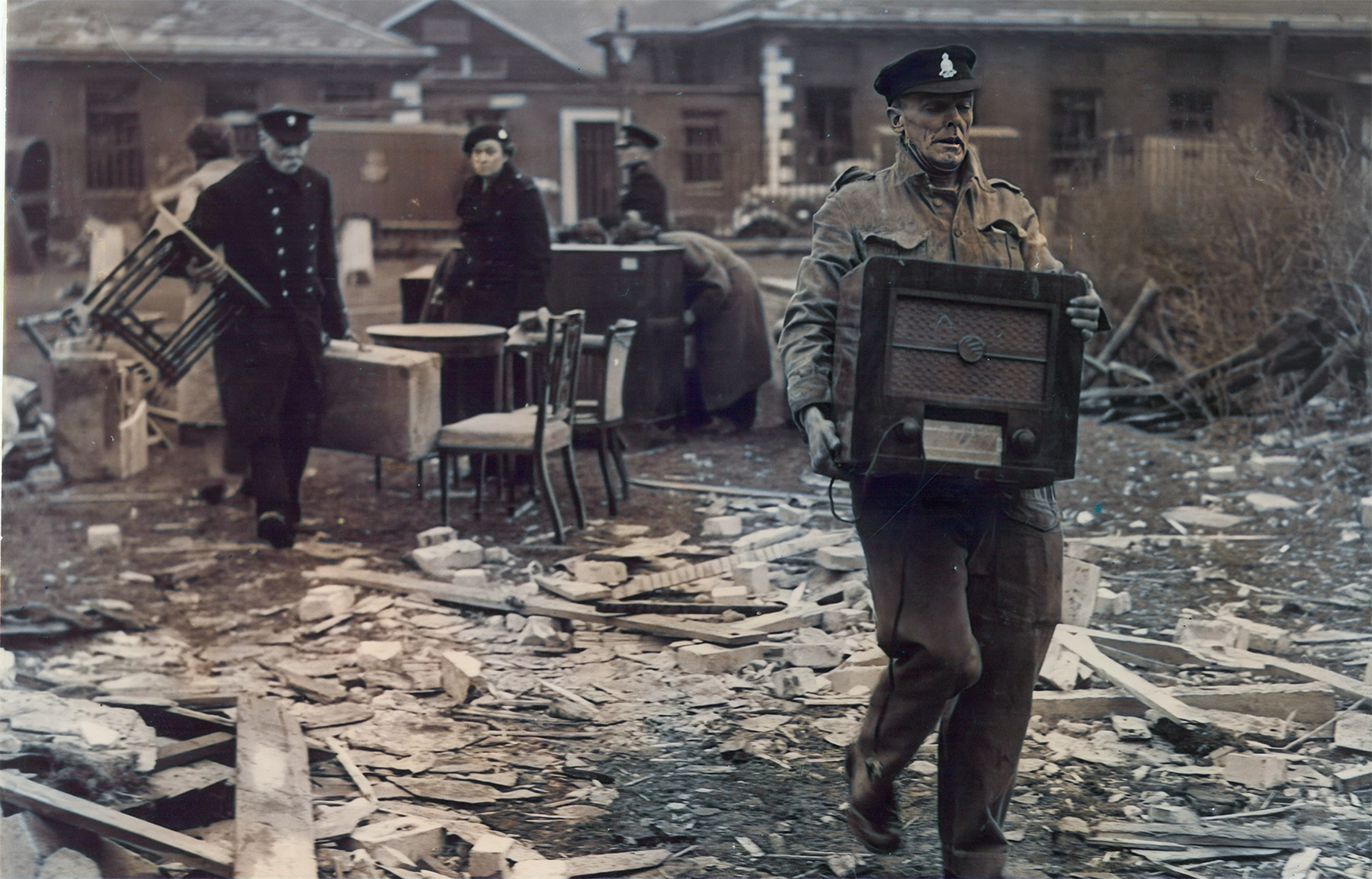 Chelsea Pensioners and staff are seen salvaging items following the destruction of the North East Wing.