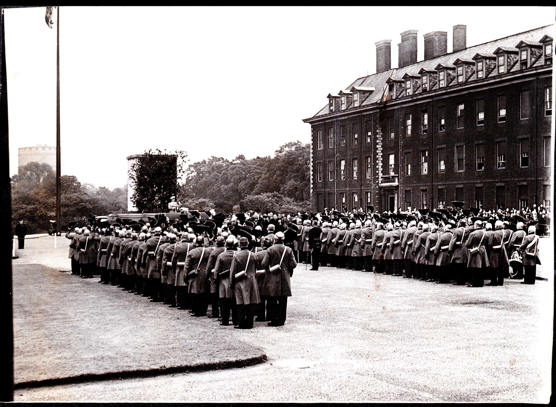 Founder’s Day at the Royal Hospital, 1942. Note the camouflaged statue of King Charles II and the gas masks. 