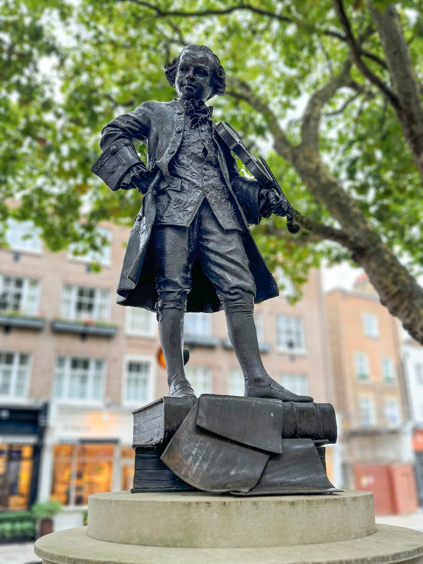 This bronze statue of the young composer Wolfgang Amadeus Mozart was commissioned by Christopher Moorsom and Francis Sitwell from Philip Jackson FRBS in 1991 to commemorate the bicentenary of the composer's death.