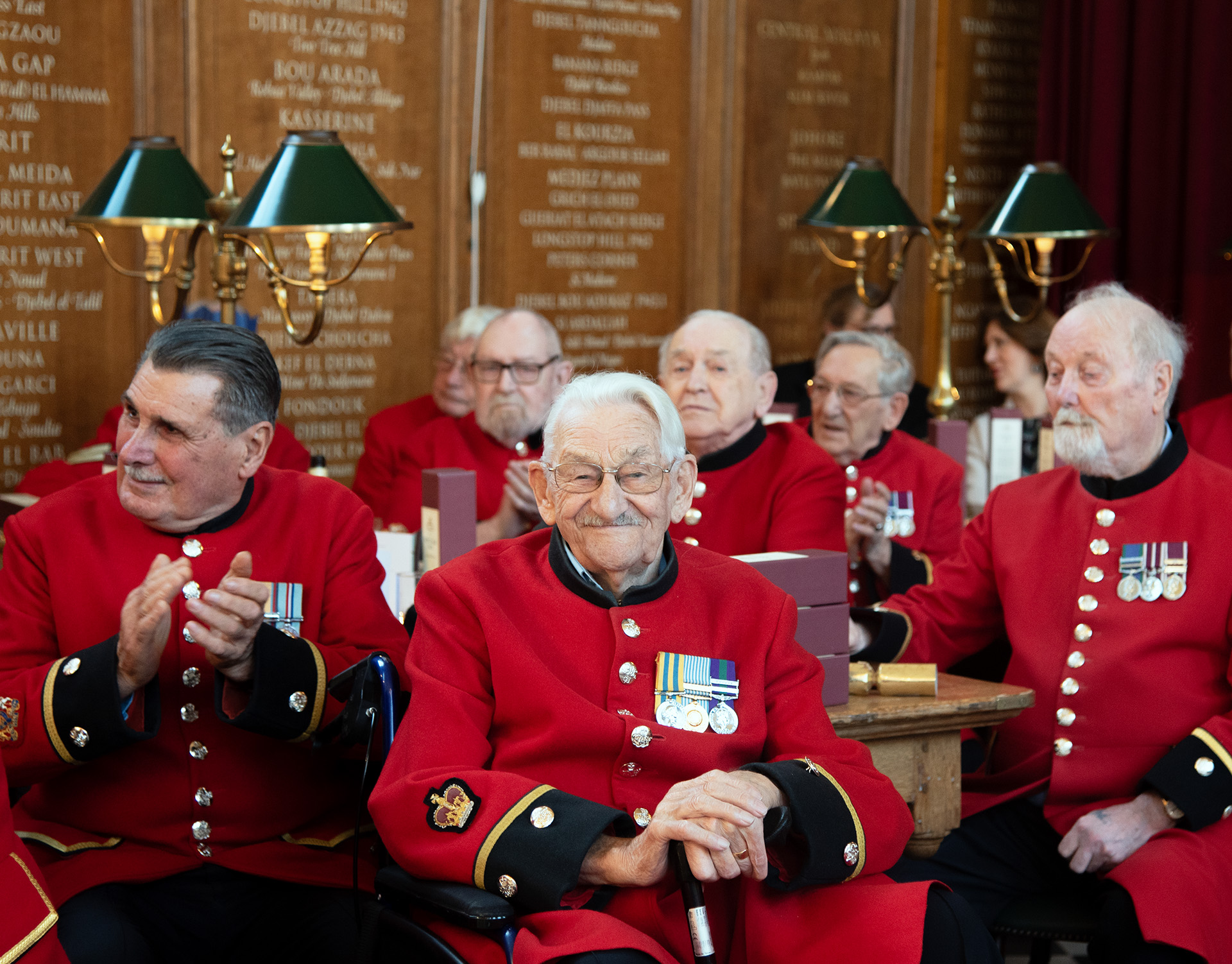 Chelsea Pensioners gather in the Great Hall for Christmas festivities