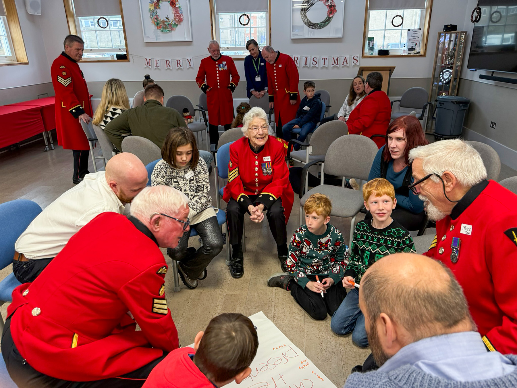 Children, families and the local community gather with Chelsea Pensioners at the Royal Hospital's Prince Philip Activity Centre 