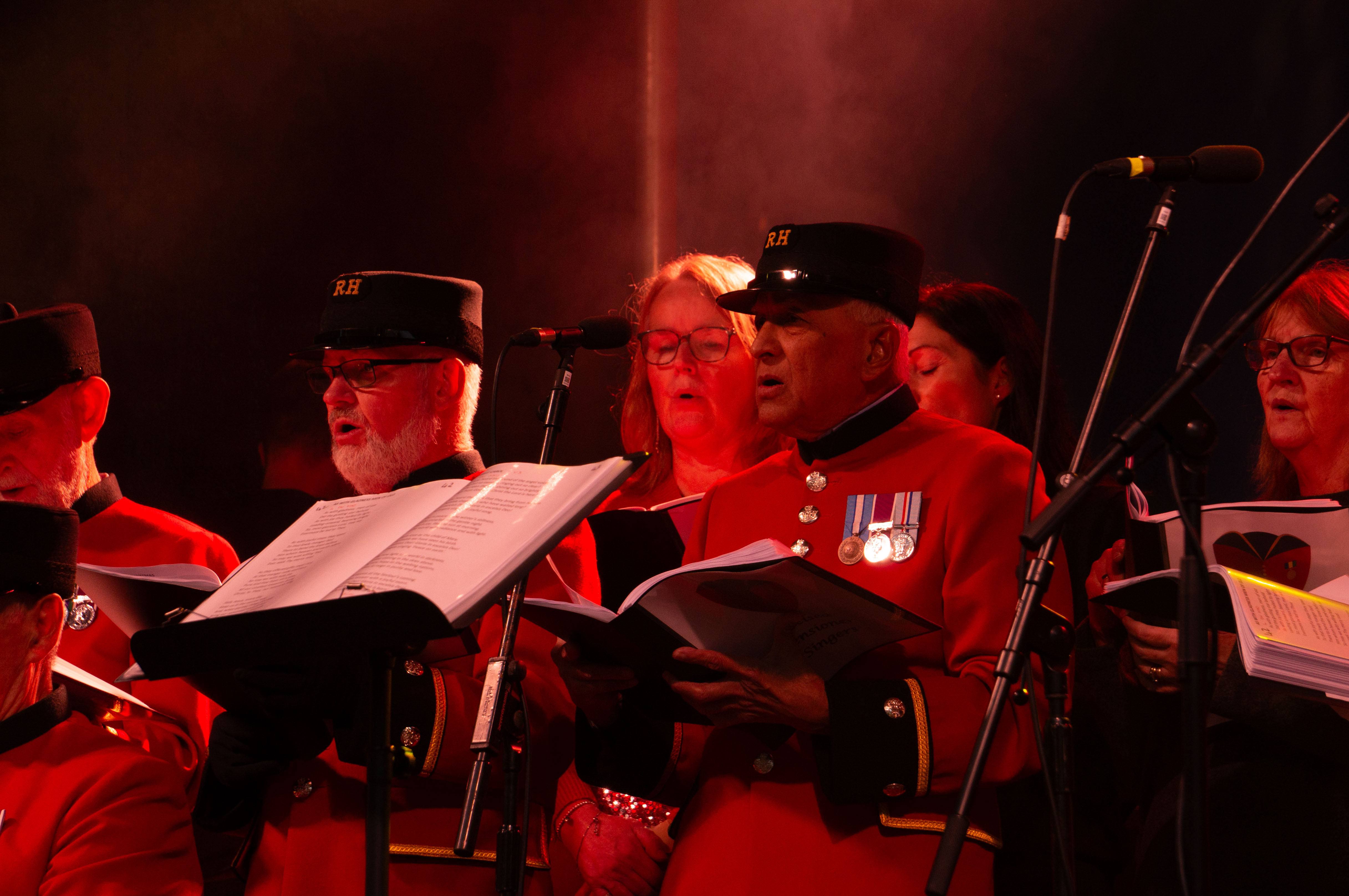 Chelsea Pensioners singing on stage