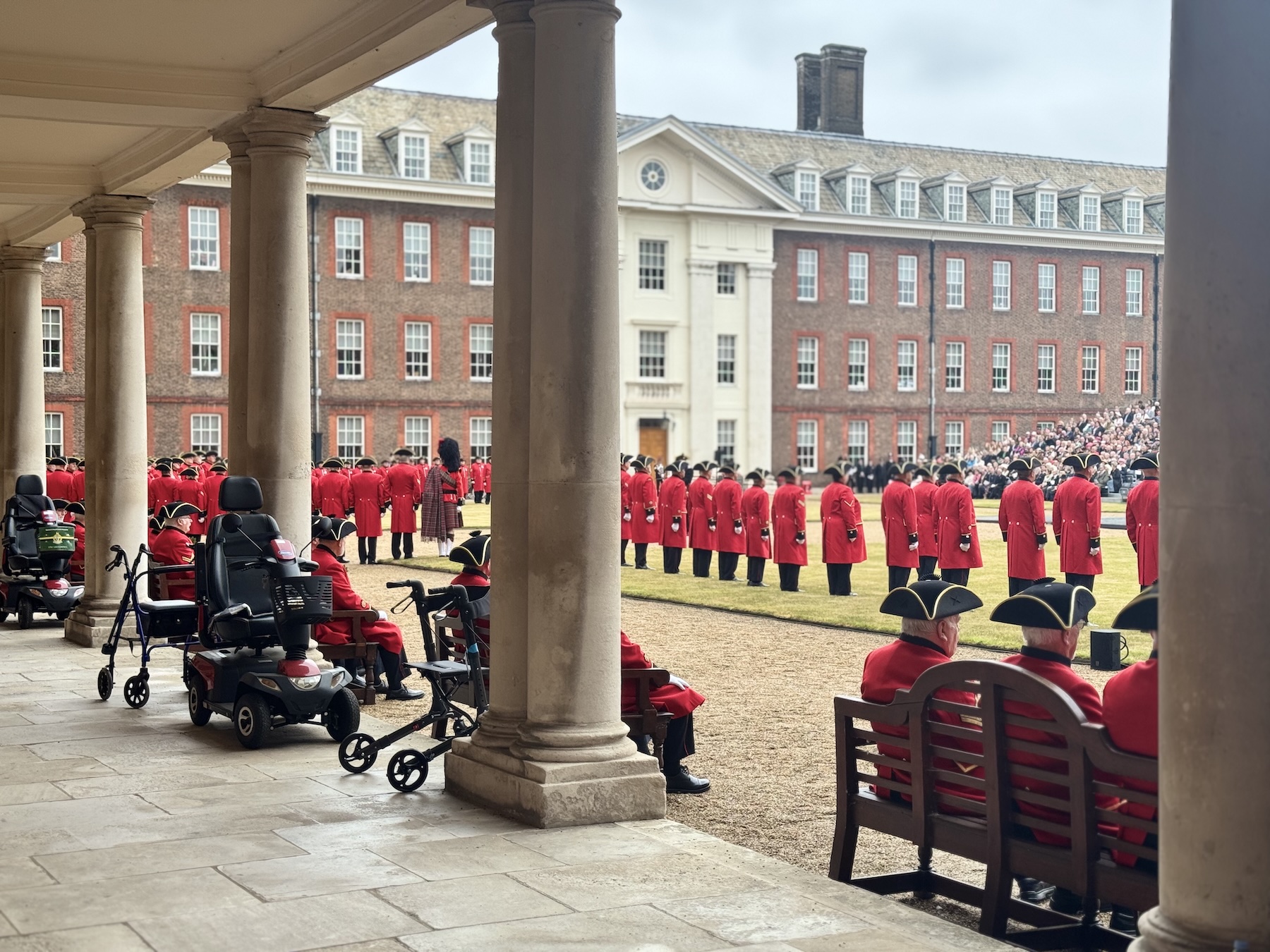 Chelsea Pensioners stand on Figure Court as they prepare to parade at Founder's Day 2025