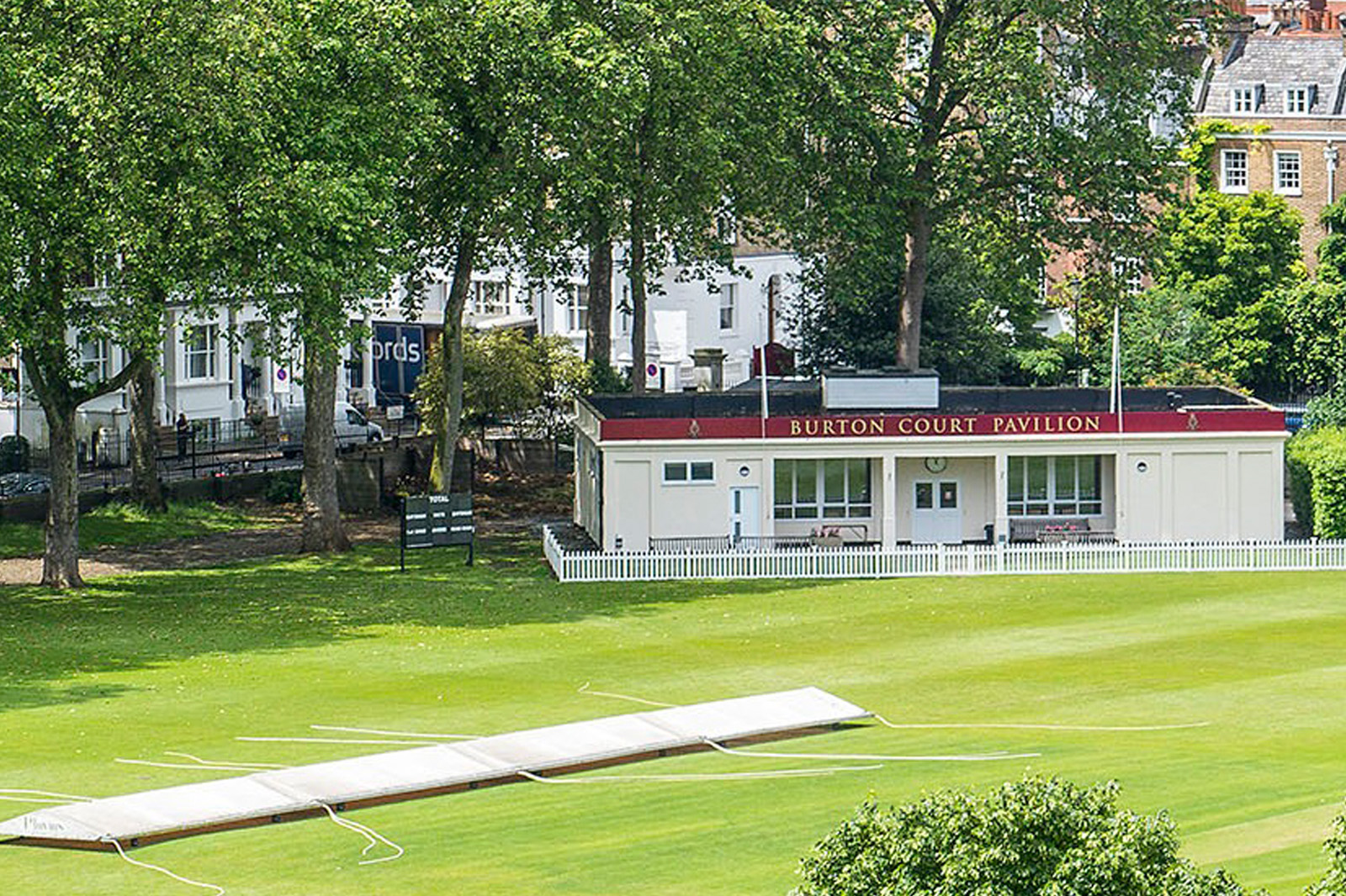 Burton Court cricket ground at the Royal Hospital Chelsea, featuring the pavilion, cricket square and mature trees in a secluded central London setting.