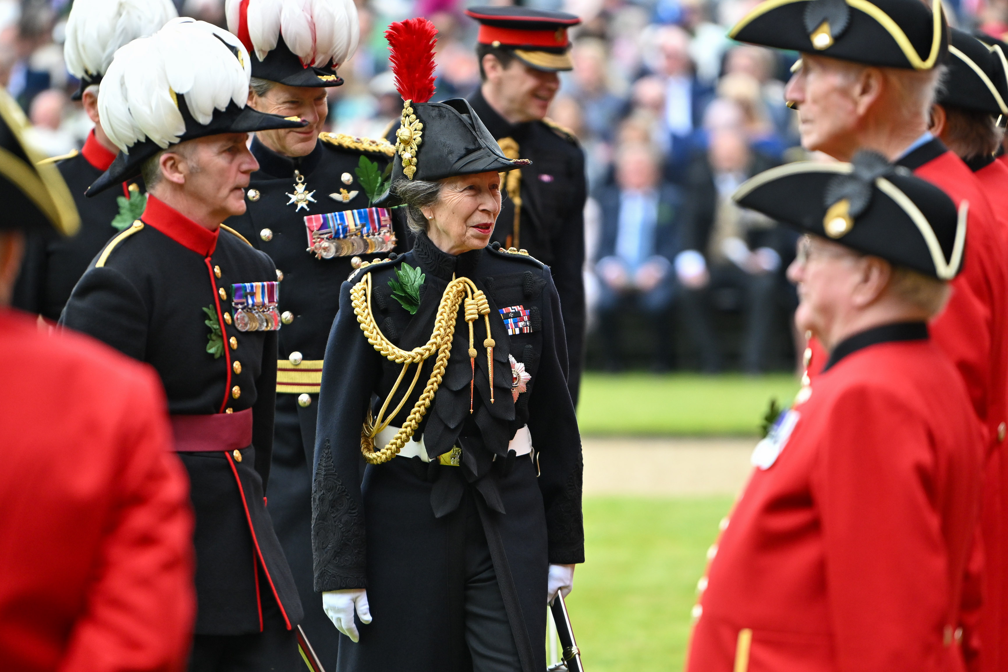 The Princess Royal smiles as she reviews the parade of Chelsea Pensioners at Founders Day