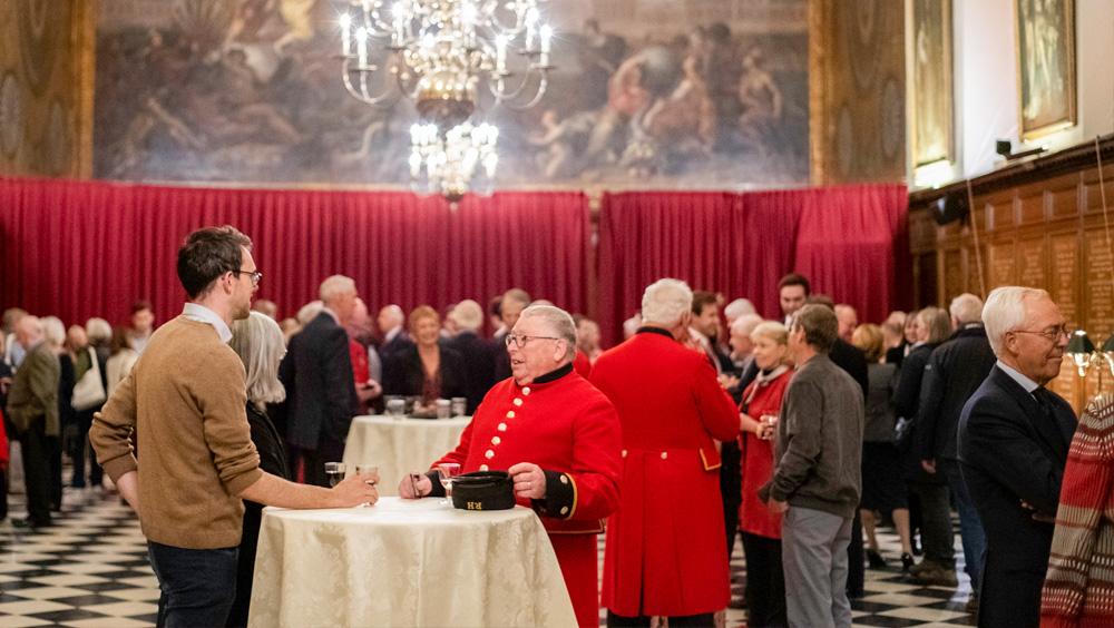 Chelsea Pensioner stand alongside supporters during an event in the Great Hall