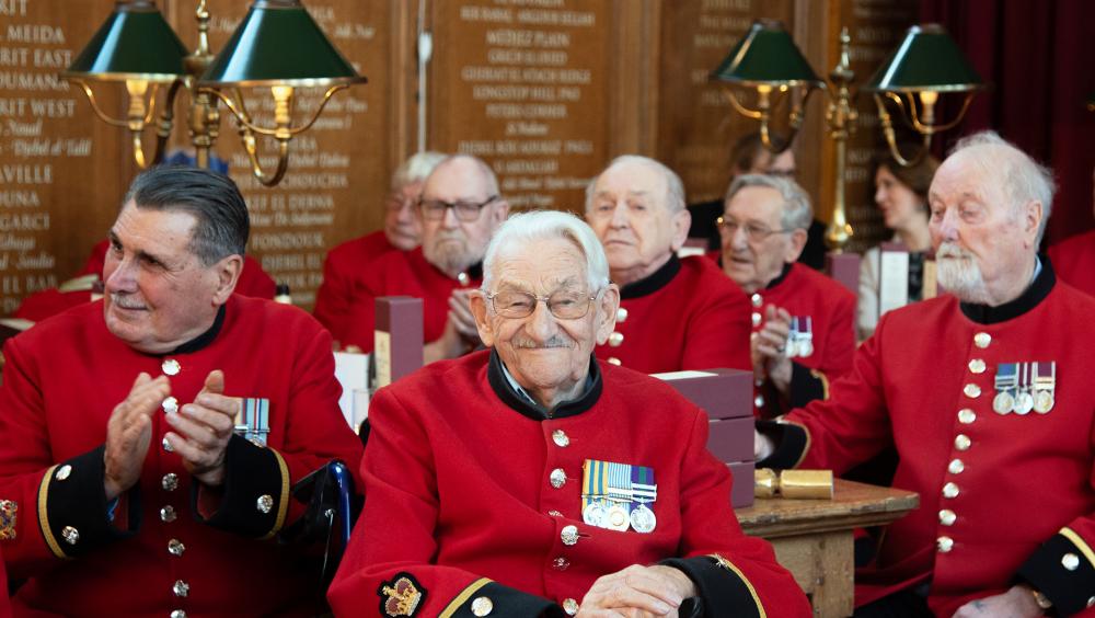 Chelsea Pensioners gather in the Great Hall for Christmas festivities