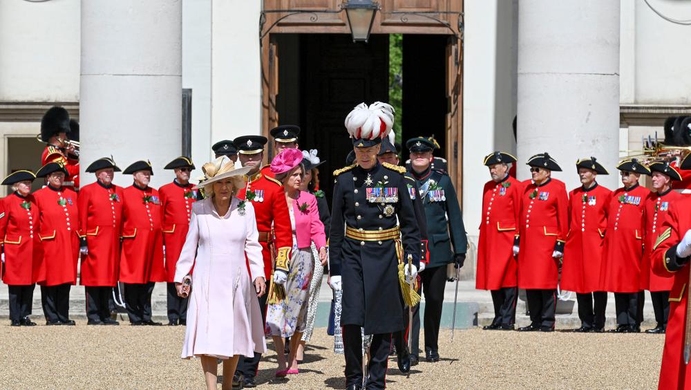 Queen Camilla arrives for Founder’s Day celebrations at the Royal Hospital Chelsea, accompanied by senior representatives as Chelsea Pensioners line Figure Court.