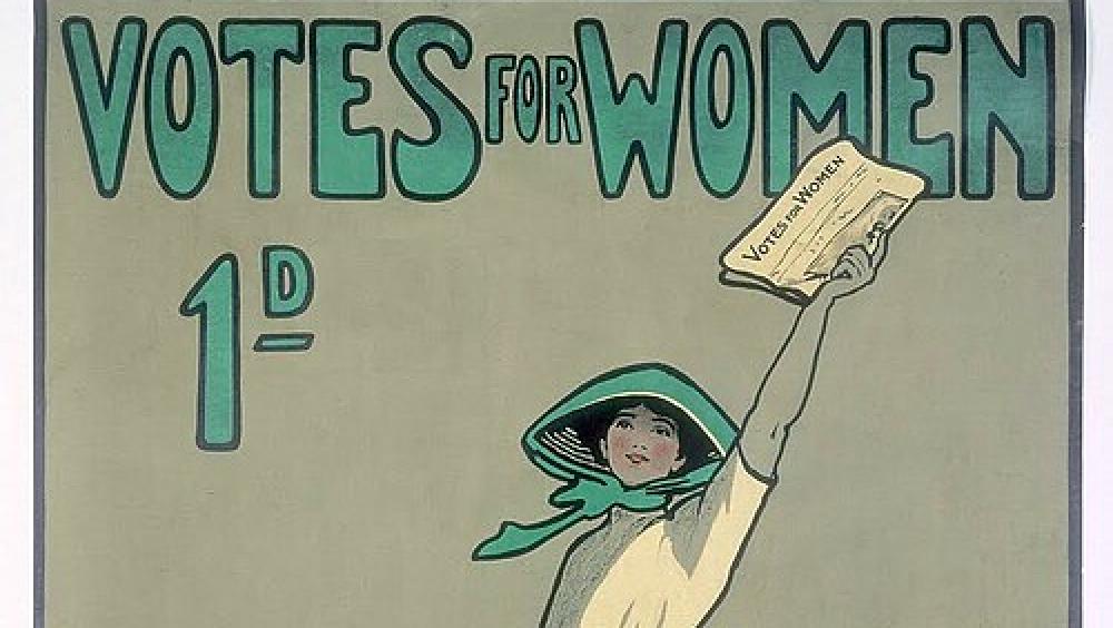 An early 20th Century poster featuring a Suffragette holding a newspaper above her head in a field. Poster is a green print with hand written text reading "Votes for Women"