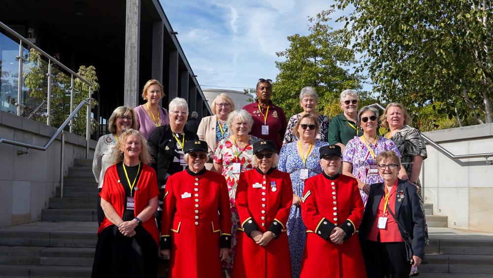 Chelsea Pensioners in scarlet uniforms with veterans and guests at the Chelsea Pensioners Veterans Outreach Garden Party at the National Memorial Arboretum.