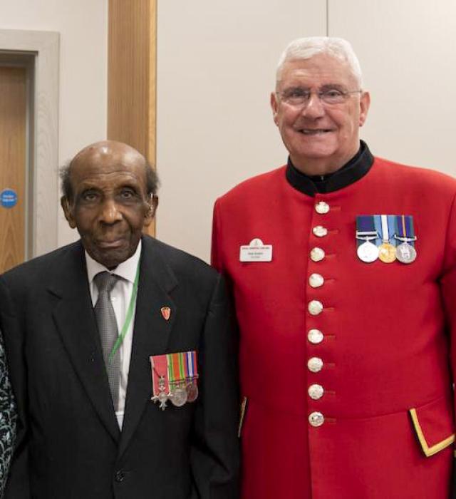 Chelsea Pensioner standing alongside a decorated British Military veteran