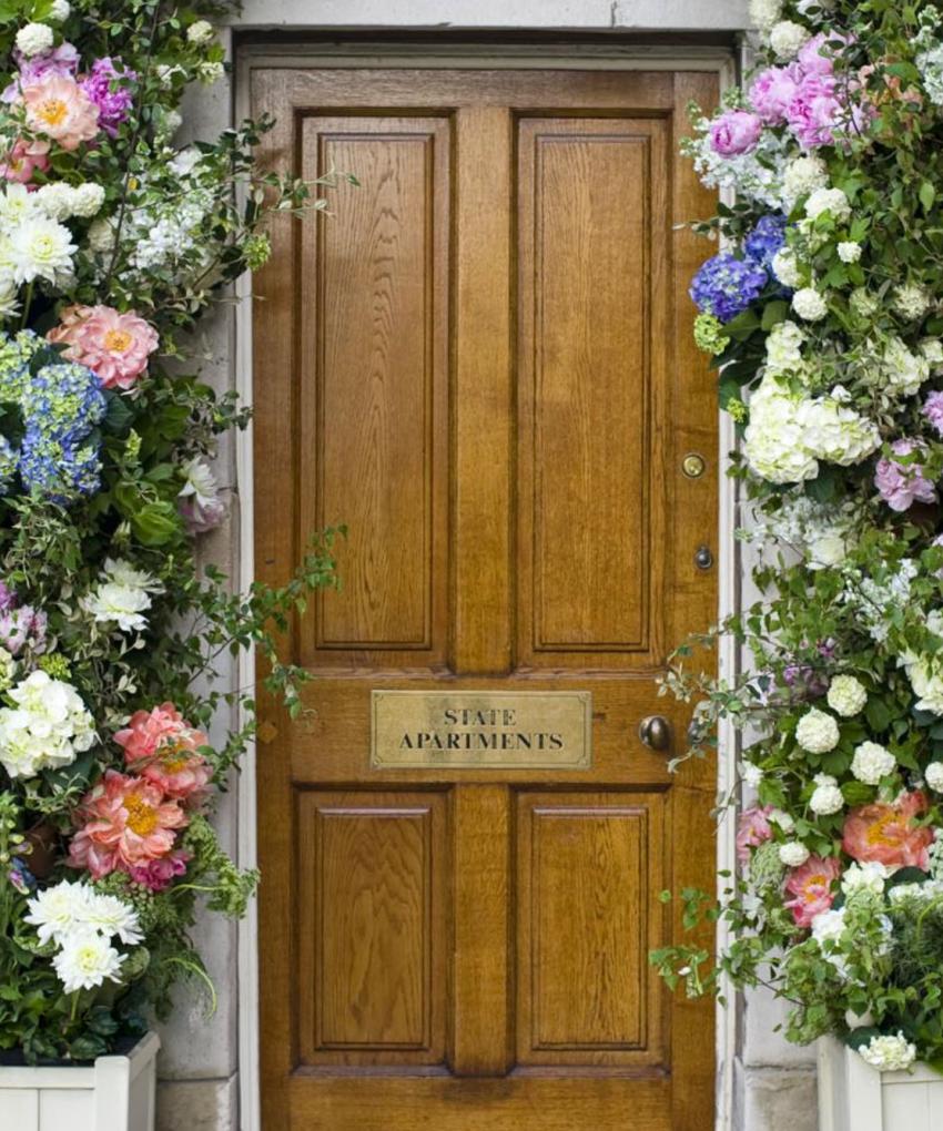 Entrance to the State Apartments at the Royal Hospital Chelsea decorated with floral arrangements for an event.