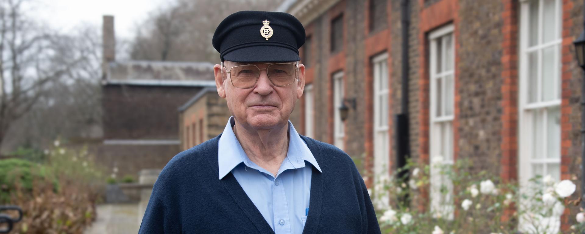 Chelsea Pensioner Roget Hall stands amongst the flower beds at the Royal Hospital Chelsea