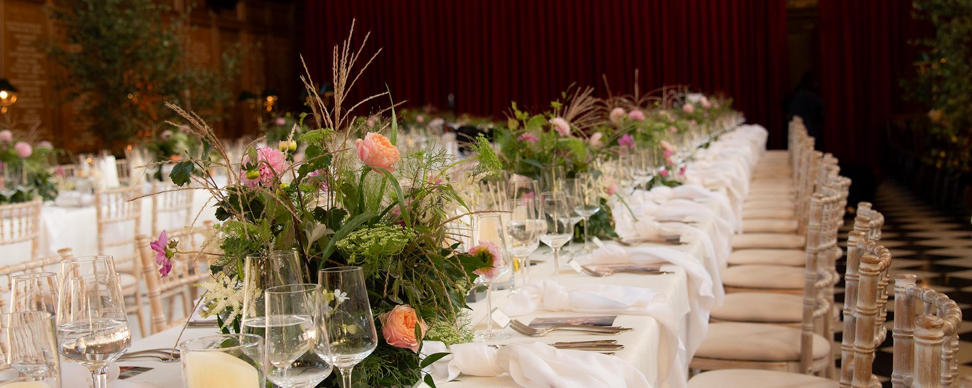 Tables beautifully laid out for a banquet in the Great Hall at The Royal Hospital Chelsea