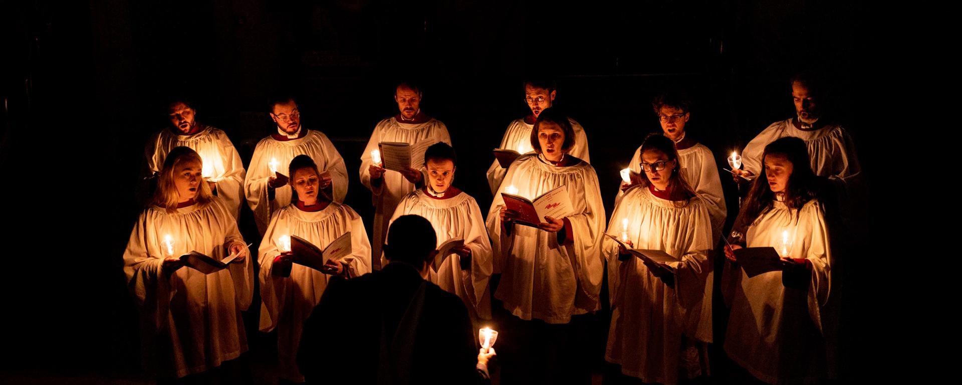 Chapel Choir of The Royal Hospital Chelsea singing in candlelight