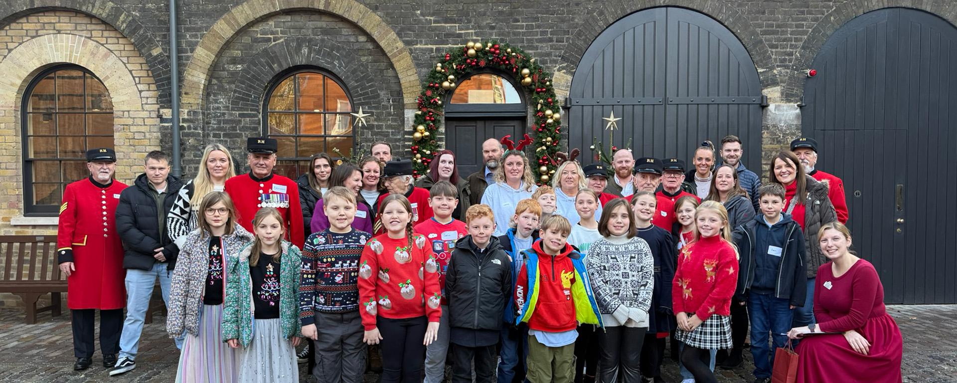 The local community gather with the Chelsea Pensioners at the Soane Stable Yard