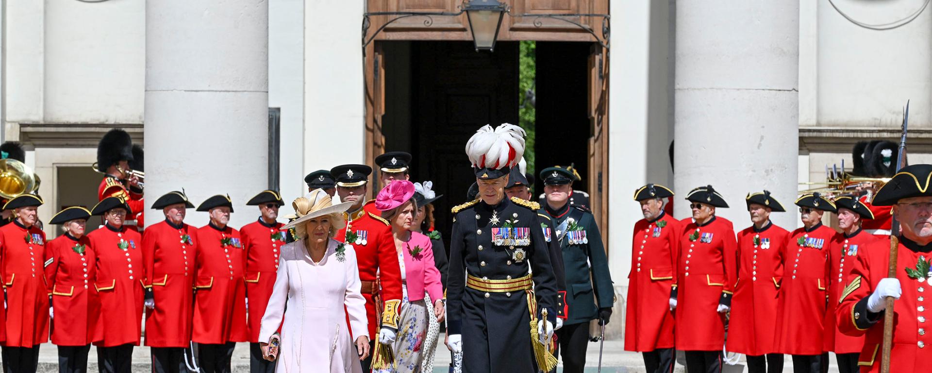 Queen Camilla arrives for Founder’s Day celebrations at the Royal Hospital Chelsea, accompanied by senior representatives as Chelsea Pensioners line Figure Court.