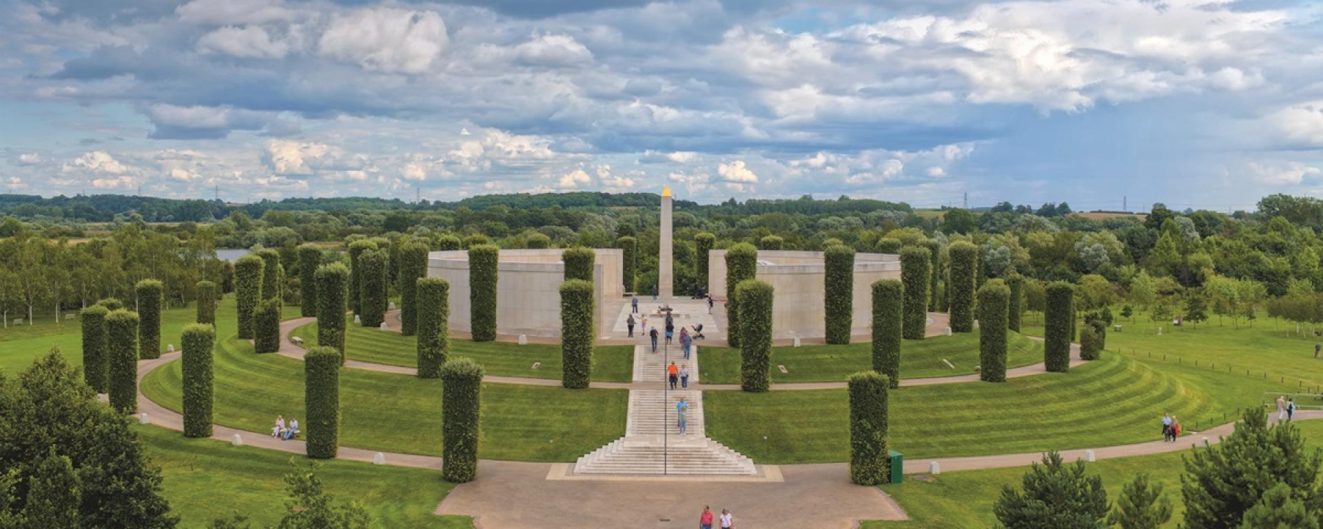 An aerial image of the national memorial arboretum with a cloudy blue sky in the background