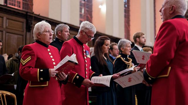 Chelsea Pensioners singing in the Wren Chapel during a service