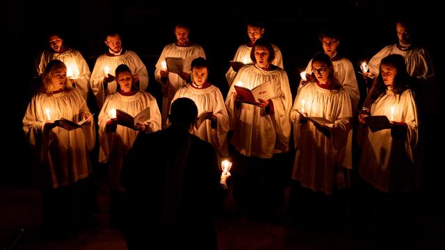 Chapel Choir of The Royal Hospital Chelsea signing in candlelight