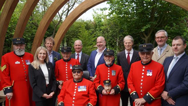 Chelsea Pensioners stand alongside the CEO and Governor of The Royal Hospital Chelsea, with designers of the Chelsea Pensioner Garden 2025
