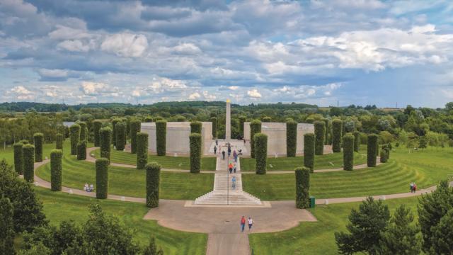 An aerial image of the national memorial arboretum with a cloudy blue sky in the background
